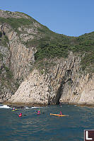 Kayakers Entering Sea Arch