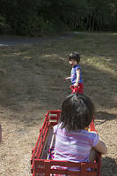 Claira Pulling Her Sister In Wagon