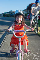 Claira Riding With Training Wheels