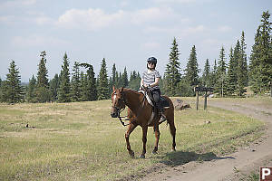 Helen Riding Next To Road