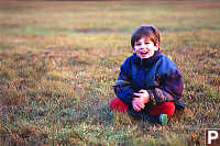 Kayla Sitting In Wet Grass