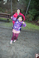 Nara On The Swing With Grandma Behind