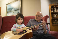 Grandpa Giving Guitar Lessons