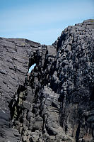 Hole Through Island Of Columnar Basalt