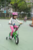 Claira On Training Wheel Bike