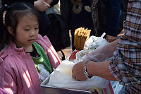 Girl Watching Candy Being Made