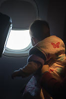 Claira Looking Out The Airplane Window