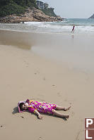 Claira Making Sand Angels