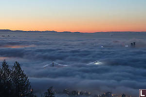 Bridge Sticking Through Clouds