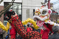Two Dragon Dancers Walking By