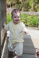 Claira Walking On Bridge Over Pond