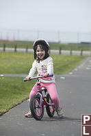 Claira Biking With Her Tongue Out