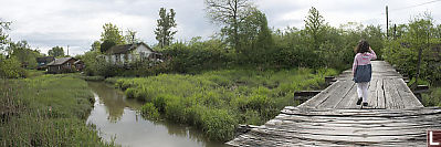 Claira Walking Over Bridge At Finn Slough