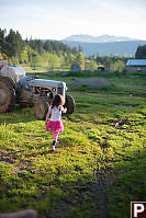 Claira Walking Past Tractor