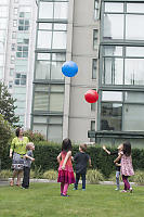 Five Kids Trying To Keep Two Balloons Airborne