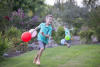 Marcus Running With Balloons