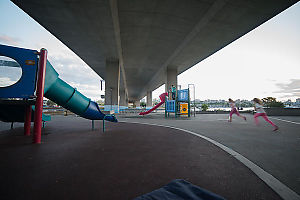 Kids Running Under Bridge