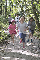 Four Kids Running Down Trail