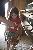 Arabella Putting Egg In Basket