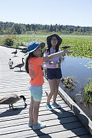 Claira Hand Feeding Red Wing Blackbird