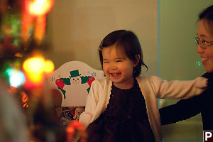 Nara Smiling At Christmas Tree