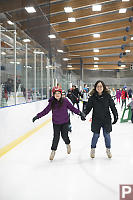 Claira And Helen Going Around Rink