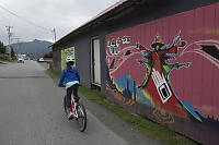 Nara Riding Past Sign