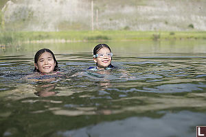 Kids Swimming In Lake