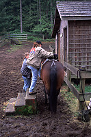 Andrea Getting on a Horse