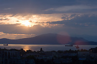 Sunbeams Golden Reflection And Freighters