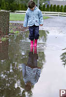 Kayla Standing In Puddle