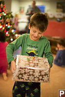 Marcus Holding Wrapped Gift