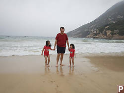 Dad And Girls At The Beach