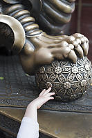 Claira Touching Lion Statue