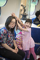 Kids Helping Mom On The Train