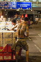 Tatoo Man Loading Boxes