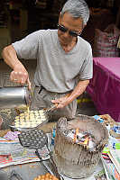 Bubble Waffle Being Poured