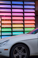 Color Panels Reflecting On White Car