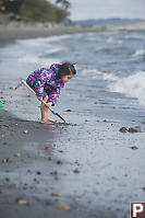 Nara Digging With Shovel At Beach