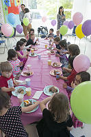 Table Full Of Kids Eating Cake