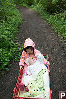 Claira Looking Up At Nara In Wagon