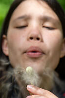 Claira Blowing Dandelion