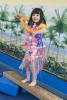 Claira Dressed As Plastic Hawaiian