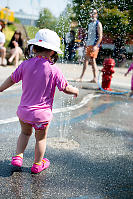 Nara Standing Toward Sprinkler