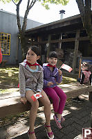 Sitting On Benches With Flags