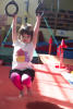 Claira Swinging On Lower Rings