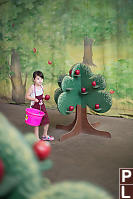 Claira Picking Apples As Farmer