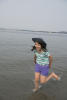 Claira Running In Shallow Water