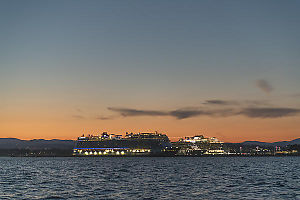 Three Cruise Ships Behind Breakwater