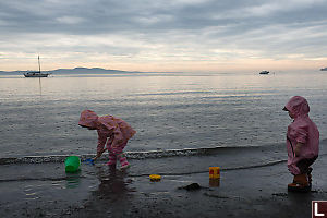 Nara And Claira At The Beach In The Rain